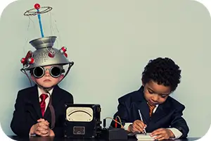 Two kids pretending they have invented a brain wave detection machine.